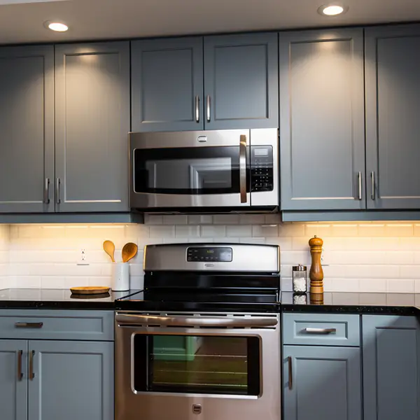 Blue-grey painted thermofoil doors beside range Blue-grey painted thermofoil doors beside range