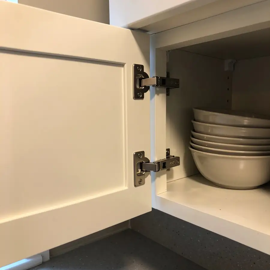 Concealed soft-close hinge on painted door