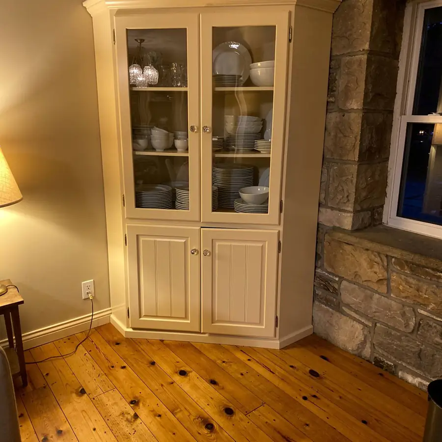 Cream painted china cabinet in Cambridge home Cream painted china cabinet in Cambridge home