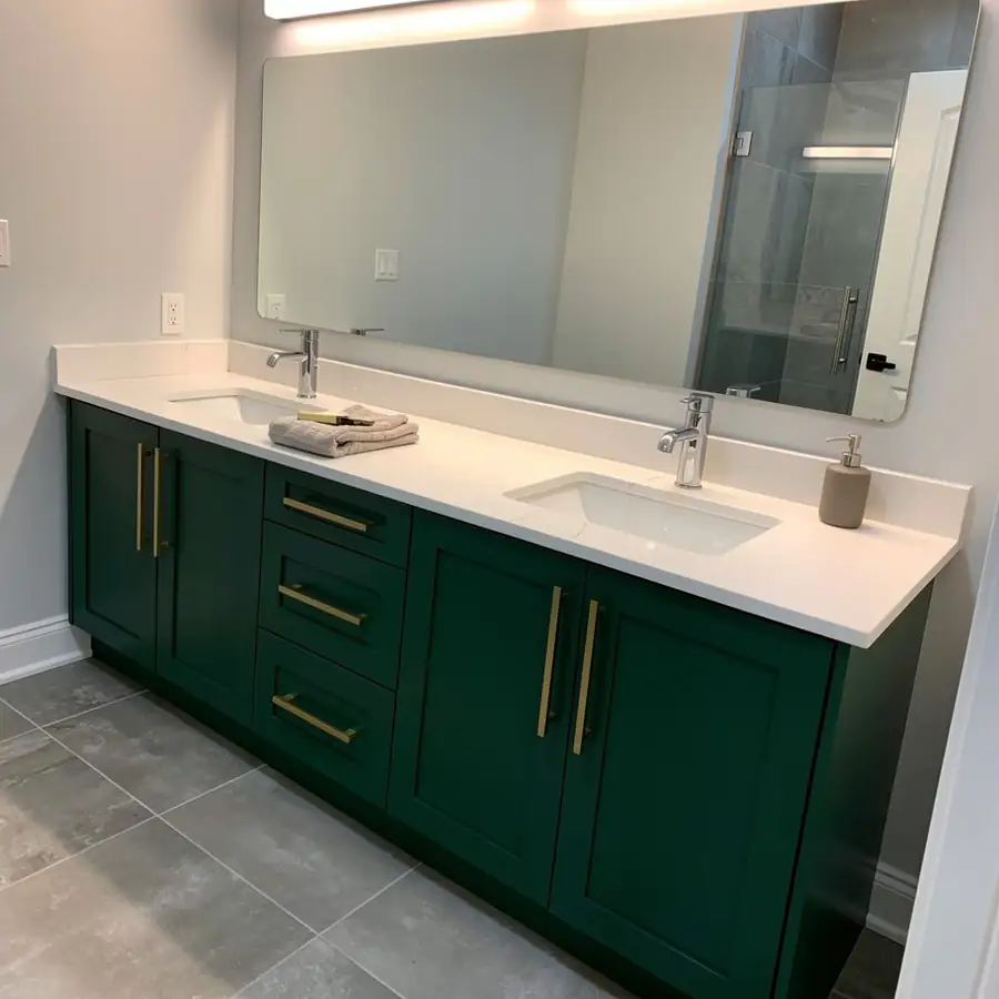 Deep green painted double vanity in ensuite
