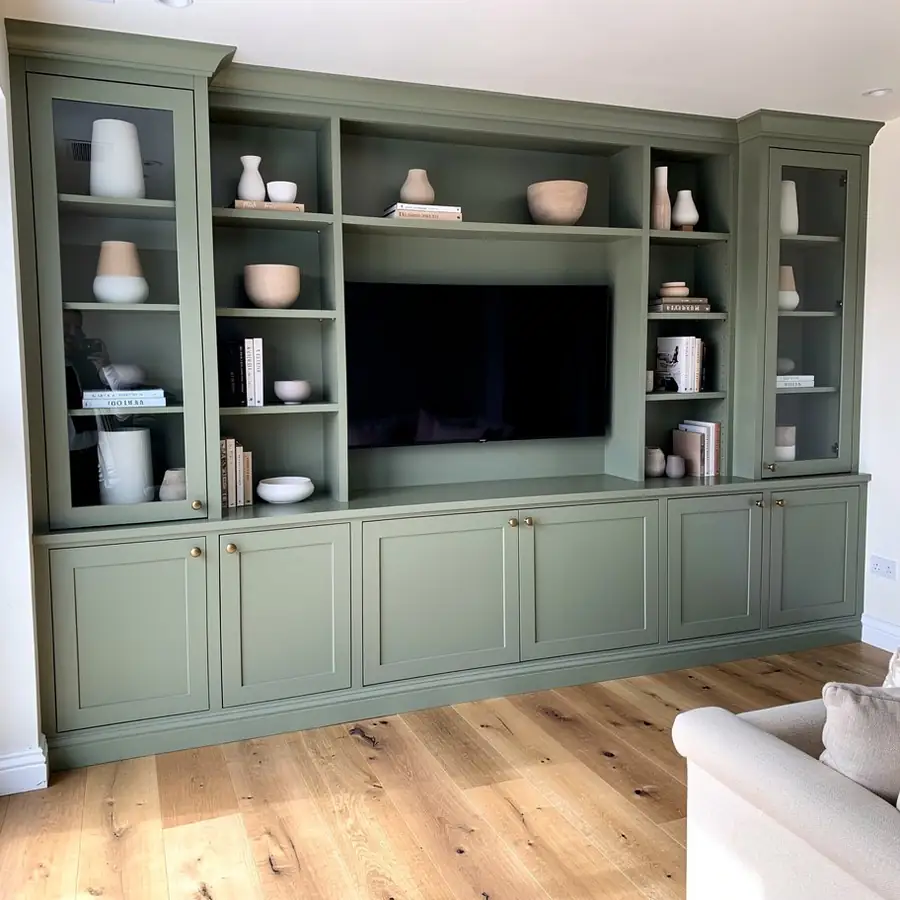 Floor-to-ceiling media wall painted sage