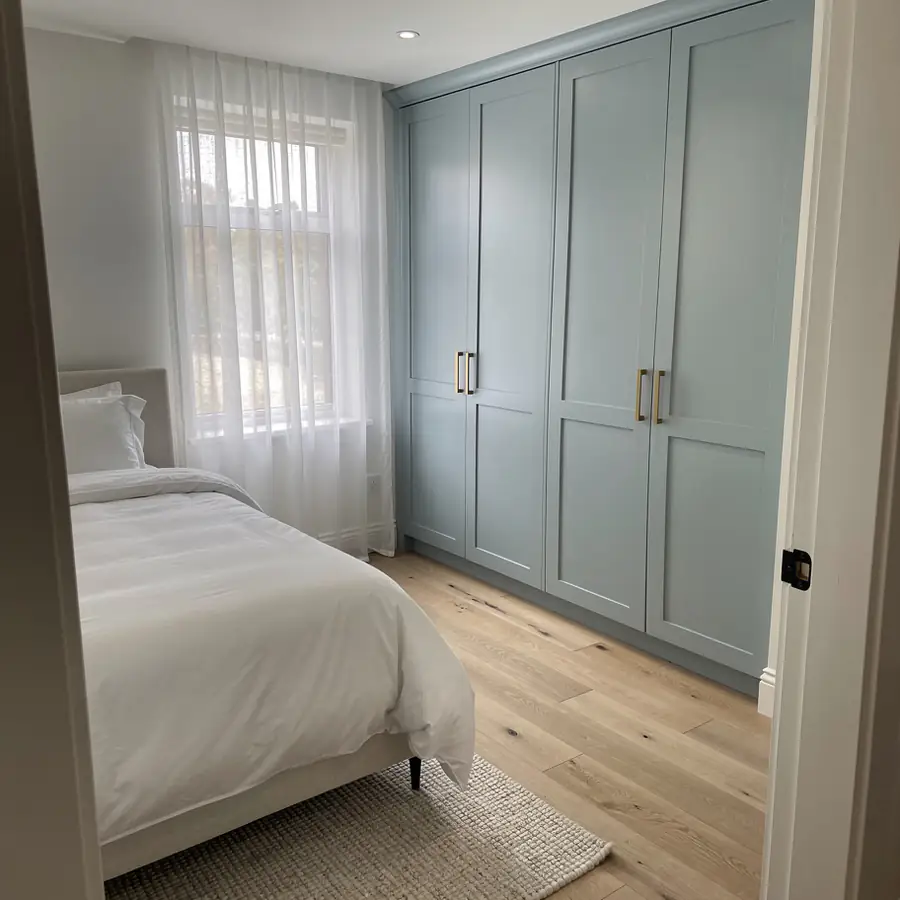 Freshly painted bedroom wardrobe in pale blue