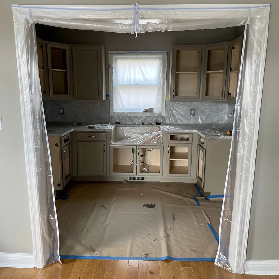 Freshly sprayed cabinet boxes inside zip walls