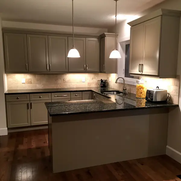 Greige raised panel kitchen cabinets in Waterloo