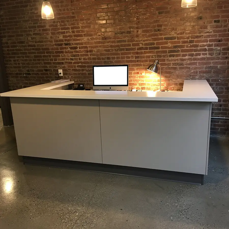 Light grey painted office reception desk