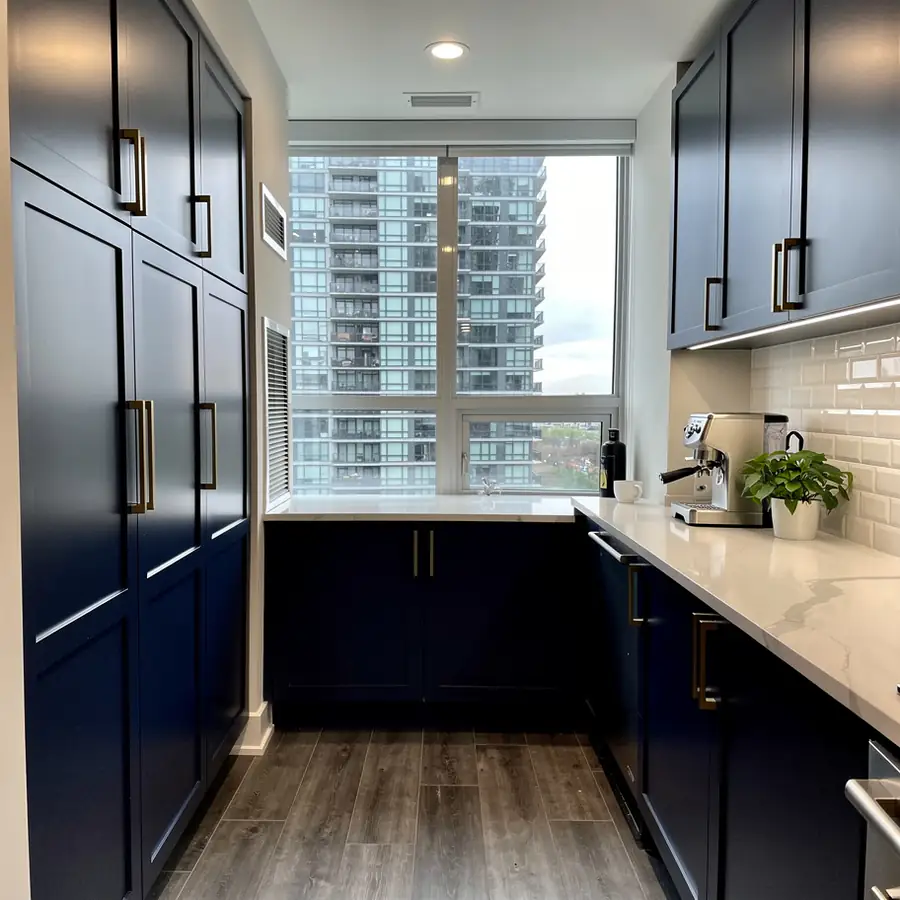 Navy painted kitchen cabinets in Kitchener condo