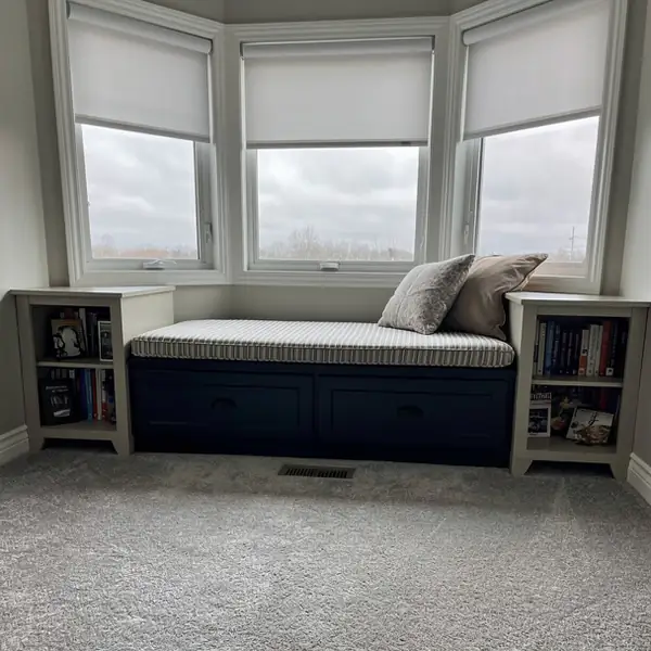 Navy painted window seat with storage drawers Navy painted window seat with storage drawers