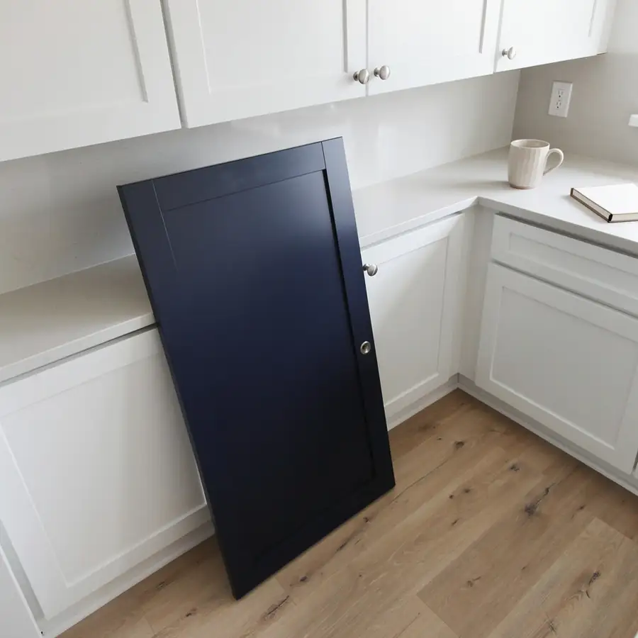 Navy sample door on kitchen counter