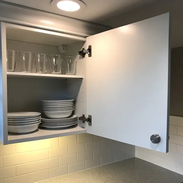 Open painted cabinet door showing sealed edge