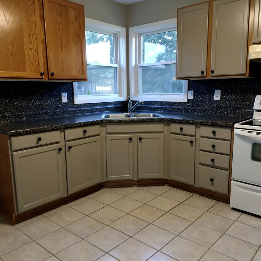 Painted original oak kitchen with granite kept
