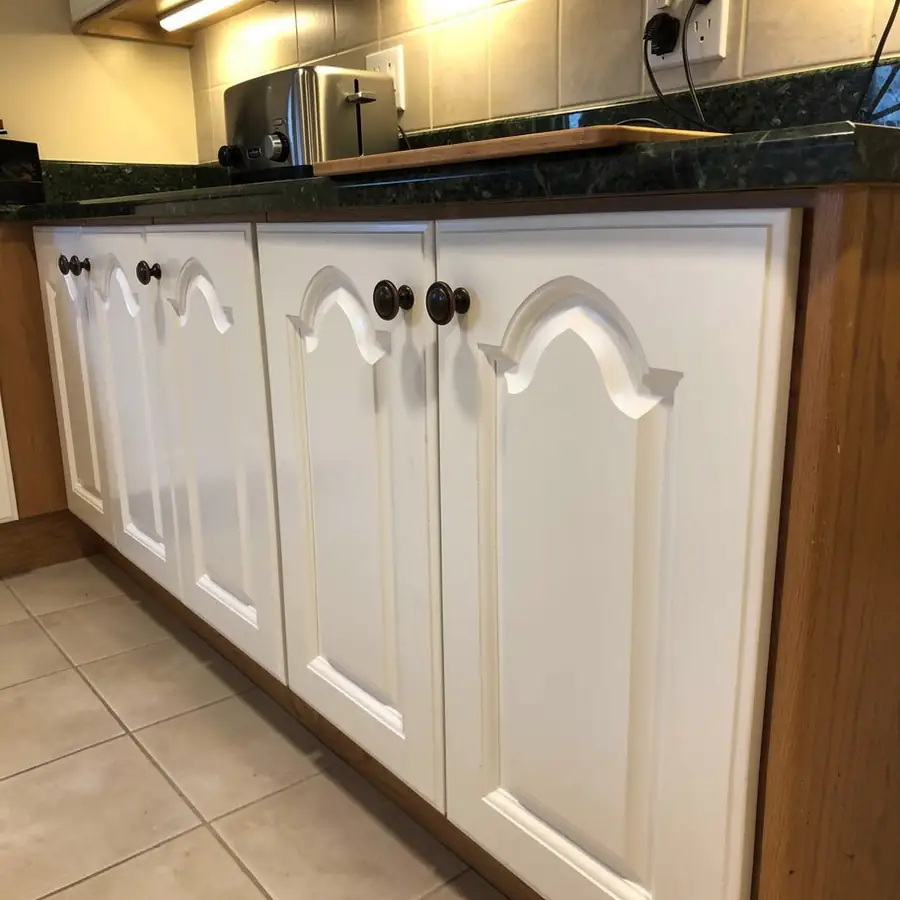 Raised panel oak doors painted Chantilly Lace