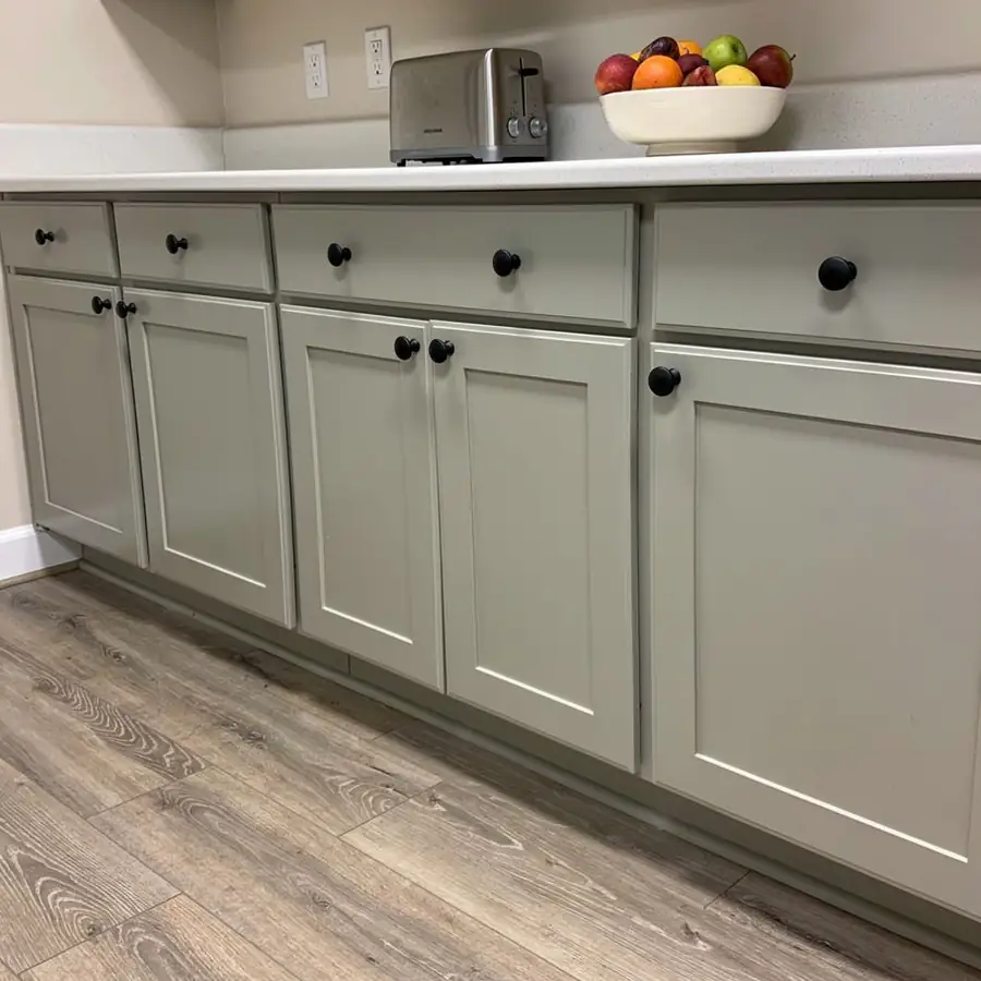 Realigned doors on painted kitchen cabinet run Realigned doors on painted kitchen cabinet run