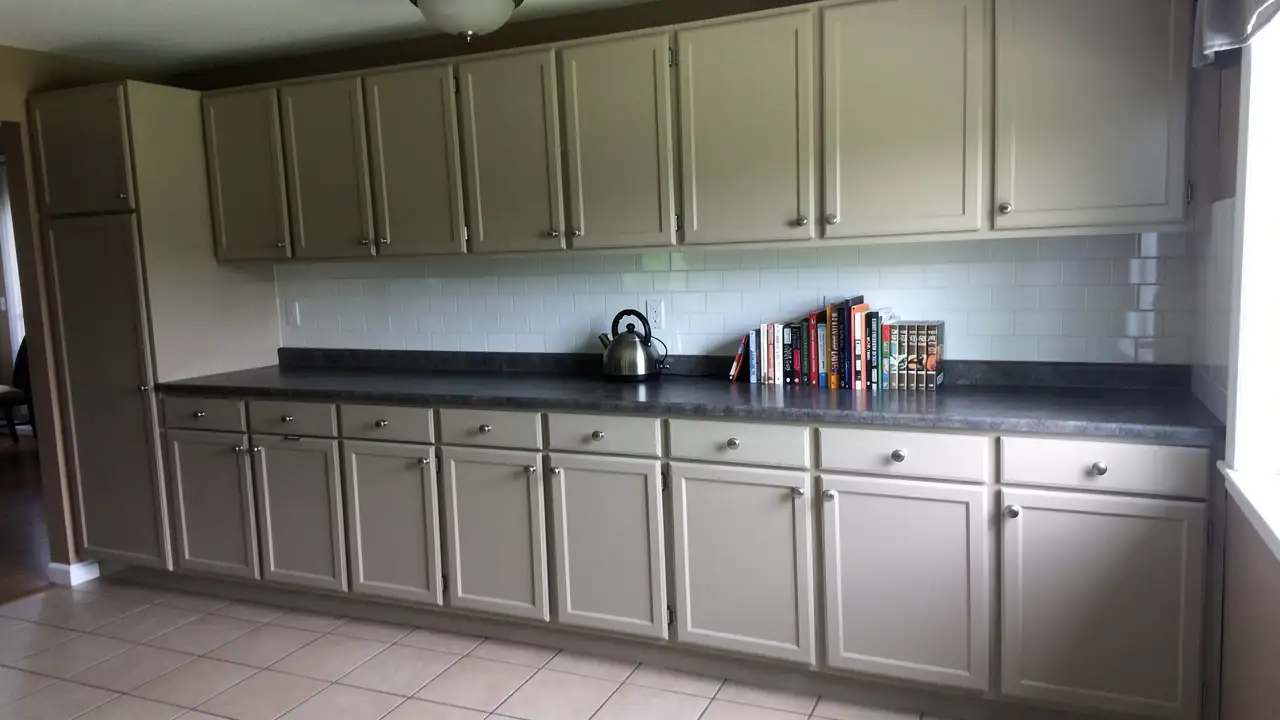 Repaired kitchen cabinets painted warm greige Kitchener Repaired kitchen cabinets painted warm greige Kitchener