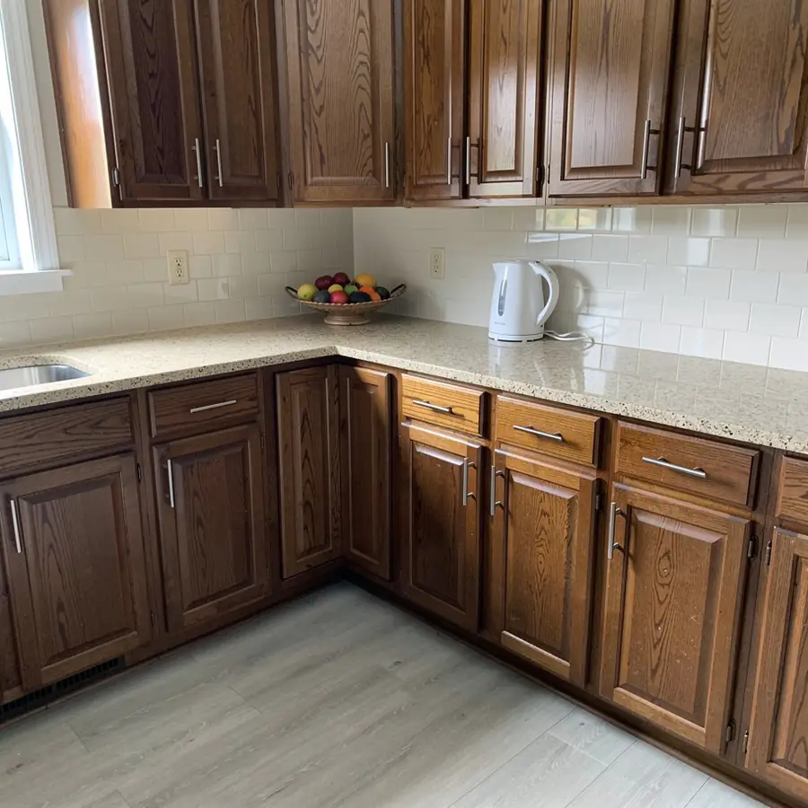 Restained walnut brown oak kitchen cabinets Kitchener