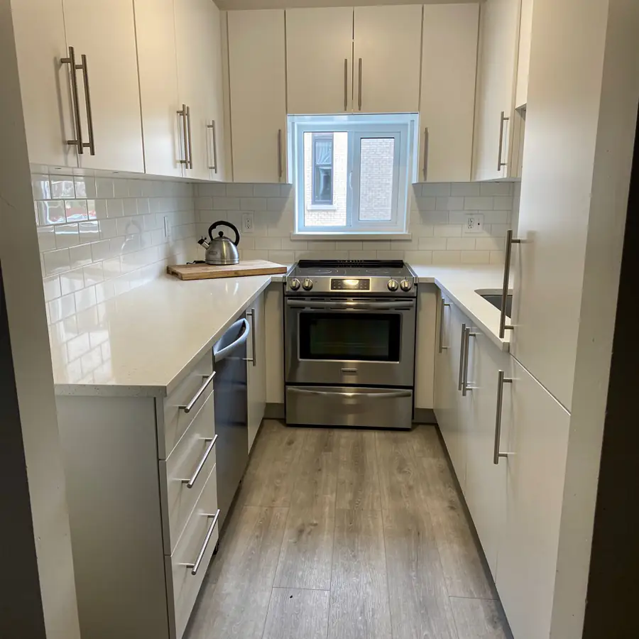 Small condo galley kitchen painted soft white