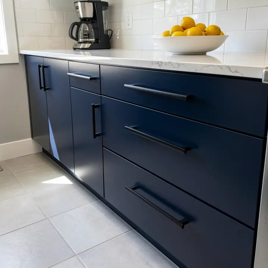 Smooth sprayed navy slab cabinets in Waterloo