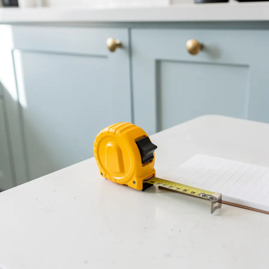 Tape measure on pale blue cabinet