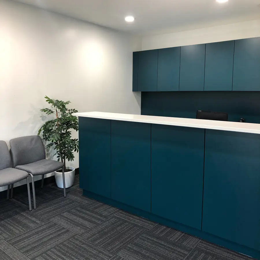 Teal painted medical clinic reception desk Teal painted medical clinic reception desk