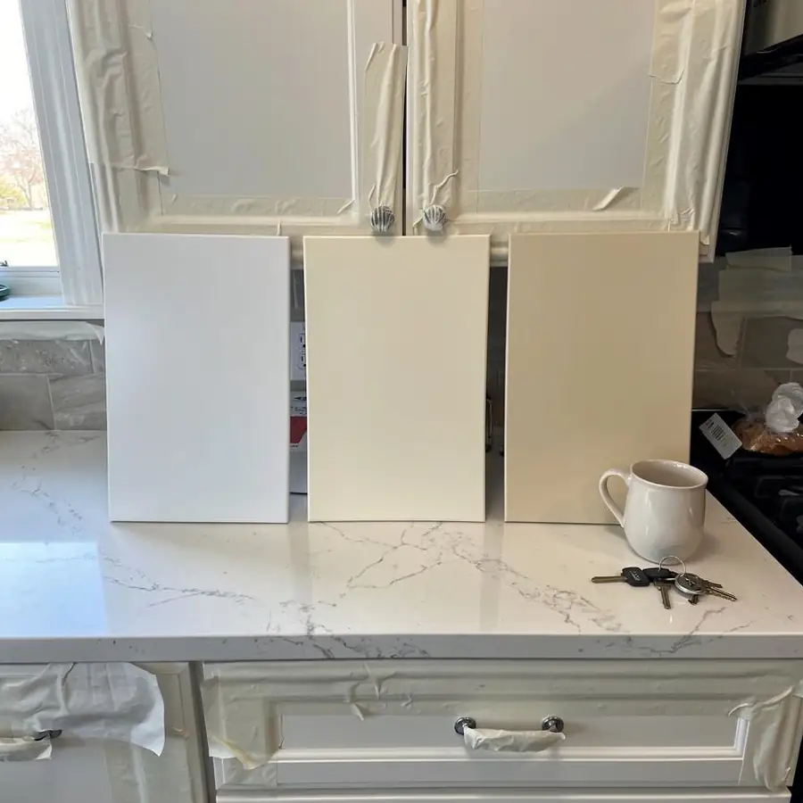 Three white sample doors against quartz counter