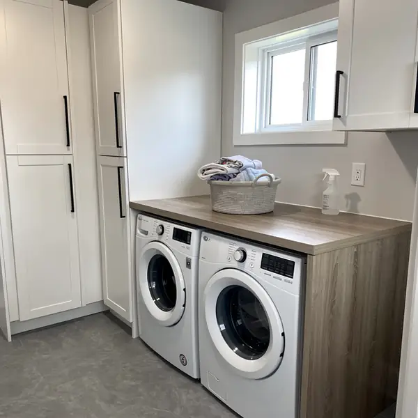 White painted melamine laundry room cabinets